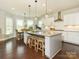 Bright, open kitchen with granite countertops, stainless appliances, and a breakfast nook at 18721 Dumbarton Oaks Dr, Cornelius, NC 28031