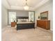 A spacious main bedroom with a large bed, dresser, and neutral decor at 18721 Dumbarton Oaks Dr, Cornelius, NC 28031