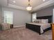 A spacious main bedroom with neutral color palette, carpet, and windows at 18721 Dumbarton Oaks Dr, Cornelius, NC 28031