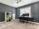 Functional home office with modern desk, dual monitors, and ample storage space with carpet at 18721 Dumbarton Oaks Dr, Cornelius, NC 28031