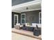 Inviting outdoor patio featuring cozy seating around a modern fire pit and stylish decor at 18721 Dumbarton Oaks Dr, Cornelius, NC 28031