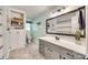 Bathroom with a neutral palette, a large mirror, and built-in shelving at 1938 Hickory Dr, Lancaster, SC 29720