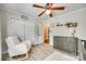 Cozy bedroom features a rocking chair, closet, dresser, and wood-look flooring at 1938 Hickory Dr, Lancaster, SC 29720