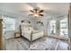 Bright bedroom with ceiling fan, natural light, and patio access at 1938 Hickory Dr, Lancaster, SC 29720