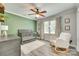 Cozy Bedroom with crib, dresser, plush chair and hardwood flooring at 1938 Hickory Dr, Lancaster, SC 29720