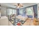 Bedroom with custom airplane wall decor, natural light, and hardwood floors at 1938 Hickory Dr, Lancaster, SC 29720