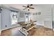 Comfortable dining room with hardwood floors and natural light from surrounding windows at 1938 Hickory Dr, Lancaster, SC 29720
