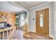 Inviting foyer featuring wood flooring, a decorative front door, and an open view to the living area at 1938 Hickory Dr, Lancaster, SC 29720