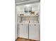 Convenient laundry closet with shelving, washer, and dryer hookups at 1938 Hickory Dr, Lancaster, SC 29720