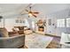 Spacious living room with a fireplace, comfortable furnishings, and a view of the exterior at 1938 Hickory Dr, Lancaster, SC 29720