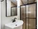 Bathroom features a modern sink, faucet, a large mirror and a glass shower enclosure at 2014 Sandhurst Dr, Charlotte, NC 28205