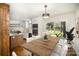 Bright dining area with view of kitchen and large window bringing the outdoors in at 2014 Sandhurst Dr, Charlotte, NC 28205