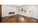 Cozy living room with hardwood floors, fireplace, and a bright, airy atmosphere at 2014 Sandhurst Dr, Charlotte, NC 28205