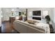 Living room with a modern fireplace and seamless access to the open-plan kitchen at 2014 Sandhurst Dr, Charlotte, NC 28205