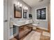 Bathroom with a double sink vanity, tile floor, and modern fixtures at 2058 Manila Bay Ln, Fort Mill, SC 29708