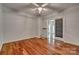 Empty bedroom with hardwood floors and access to an outdoor balcony at 2058 Manila Bay Ln, Fort Mill, SC 29708