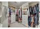 Walk-in closet with custom shelving, rods, and ample storage for clothing and accessories at 2058 Manila Bay Ln, Fort Mill, SC 29708