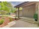 Inviting front porch area with tiled flooring and manicured landscaping, offering a warm welcome to visitors at 2058 Manila Bay Ln, Fort Mill, SC 29708