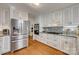 Modern kitchen featuring stainless steel appliances, custom cabinetry, and granite countertops at 2058 Manila Bay Ln, Fort Mill, SC 29708