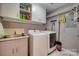 Well-equipped laundry room with a sink, storage, and washer/dryer at 2058 Manila Bay Ln, Fort Mill, SC 29708