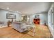 Bright living room featuring hardwood floors, a comfortable sectional sofa, and modern decor at 2058 Manila Bay Ln, Fort Mill, SC 29708