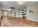 Bright living room with hardwood floors flowing into the kitchen area at 2058 Manila Bay Ln, Fort Mill, SC 29708