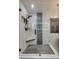 Modern shower with a frameless glass door, gray tile accents, and a built-in corner seat at 2058 Manila Bay Ln, Fort Mill, SC 29708