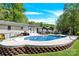 Backyard pool with a deck, backyard space, and patio at 2315 Collins Dr, Albemarle, NC 28001