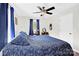 A bedroom filled with natural light with a double bed and ceiling fan at 2315 Collins Dr, Albemarle, NC 28001