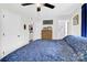 A bedroom filled with natural light with a double bed and ceiling fan at 2315 Collins Dr, Albemarle, NC 28001