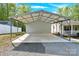 A large carport offers sheltered parking and adds convenience to this lovely home at 2315 Collins Dr, Albemarle, NC 28001
