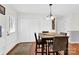 Well-lit dining area features a modern light fixture and hardwood floors at 2315 Collins Dr, Albemarle, NC 28001