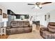 Comfortable living room showcases leather seating and flows into the kitchen and dining areas at 2315 Collins Dr, Albemarle, NC 28001