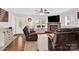 Inviting living room features a stone fireplace, large windows, and cozy leather furniture at 2315 Collins Dr, Albemarle, NC 28001
