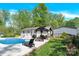 An inviting backyard pool and covered patio enhance outdoor living, with a lush lawn and privacy fence at 2315 Collins Dr, Albemarle, NC 28001
