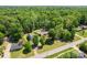 Beautiful aerial view of the home and surrounding lush green landscape at 2615 Toddville Rd, Charlotte, NC 28214