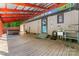 Large covered back porch with a hot tub, outdoor sink, and wood flooring at 2615 Toddville Rd, Charlotte, NC 28214