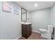Cozy bathroom features a dark wood vanity and vinyl flooring at 2615 Toddville Rd, Charlotte, NC 28214