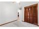 Cozy bedroom with plush carpet, ceiling fan, and wood closet doors offers a relaxing retreat at 2615 Toddville Rd, Charlotte, NC 28214