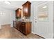 Well-appointed kitchen featuring stainless steel appliances, granite countertops, and classic wood cabinets at 2615 Toddville Rd, Charlotte, NC 28214