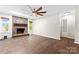 Spacious living room with hardwood flooring, fan, and brick fireplace at 2615 Toddville Rd, Charlotte, NC 28214