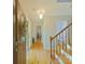 Inviting foyer with hardwood floors, wooden staircase, and decorative wreath on the front door at 3063 Wimbledon Ln, Rock Hill, SC 29732