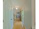 Inviting hallway with hardwood floors, light walls and trim, leading to an open dining area and staircase at 3063 Wimbledon Ln, Rock Hill, SC 29732