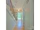 Hallway featuring wooden stairs and floors, natural light and neutral wall paint at 3063 Wimbledon Ln, Rock Hill, SC 29732