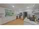 Bright kitchen featuring stainless steel appliances, white cabinets, and wood flooring at 3063 Wimbledon Ln, Rock Hill, SC 29732
