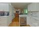 Modern kitchen with white cabinets, stainless steel appliances, and a beverage refrigerator at 3063 Wimbledon Ln, Rock Hill, SC 29732