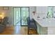Modern kitchen with white countertops, stainless steel appliances, and an adjacent sunroom offering picturesque views at 3063 Wimbledon Ln, Rock Hill, SC 29732