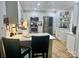 Bright kitchen featuring white cabinets, stainless steel appliances, and a stylish breakfast bar at 3063 Wimbledon Ln, Rock Hill, SC 29732
