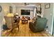 Cozy living room with hardwood floors, a fireplace, and comfortable seating at 3063 Wimbledon Ln, Rock Hill, SC 29732