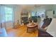 Spacious living room featuring a fireplace, hardwood floors, and ample natural light from a large window at 3063 Wimbledon Ln, Rock Hill, SC 29732
